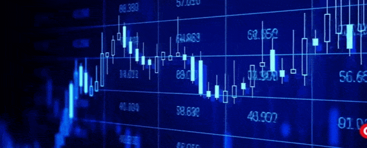 Stock market data displayed on a digital screen, showing various indices and stock prices in real-time.