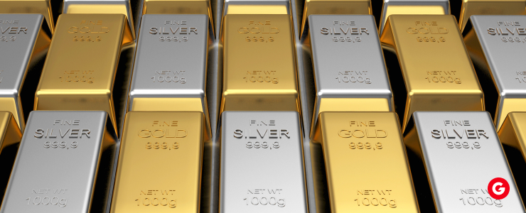 Stacked gold bars arranged in neat rows, showcasing their shiny surfaces and uniform shapes.