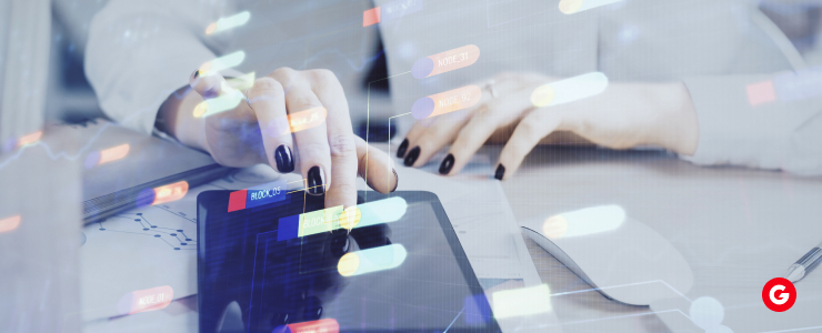 Hands analyzing digital charts on a tablet, symbolizing MT4’s use of AI-powered trade alerts and automation.